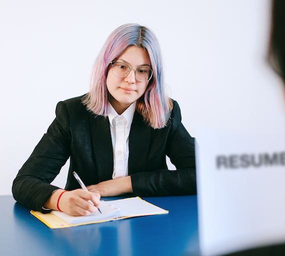 a young person with colorful hair, with a resume